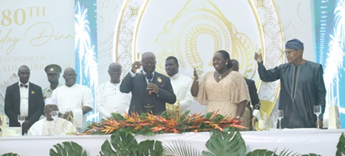 Asantehene, Otumfuo Osei Tutu II (holding mic), with his wife, Lady Julia Osei Tutu (2nd from right), and Dr Ibn Chambas (right), former President of the ECOWAS Commission, proposing a toast to honour Alhaji Yusif Ibrahim (seated left), on his 80th birthday, held at the Manhyia Palace in Kumasi last Friday. Picture: EMMANUEL BAAH Asantehene, Otumfuo Osei Tutu II (holding mic), with his wife, Lady Julia Osei Tutu (2nd from right), and Dr Ibn Chambas (right), former President of the ECOWAS Commission, proposing a toast to honour Alhaji Yusif Ibrahim (seated left), on his 80th birthday, held at the Manhyia Palace in Kumasi last Friday. Picture: EMMANUEL BAAH