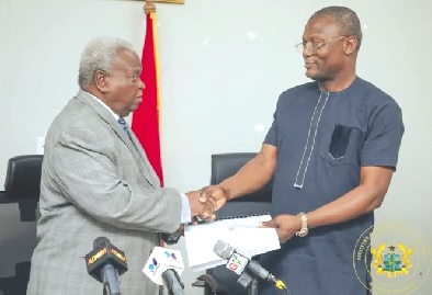 • Kofi Adams, Minister of Sports and Recreation receiving the report from Mr Amarkai Amarteifio • Kofi Adams, Minister of Sports and Recreation receiving the report from Mr Amarkai Amarteifio