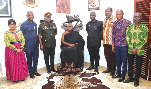 Odeneho Kwafo Akoto III (seated), Akwamuhene, with Brig. Gen. Maxwell Mantey (3rd from left), Director-General, Narcotics Control Commission; Alexander Twum-Barima (4th from right), Deputy Director-General of Enforcement, Control and Elimination, and some management team from the Commission after the meeting in Akwamufie. Picture: ELVIS NII NOI DOWUONA 