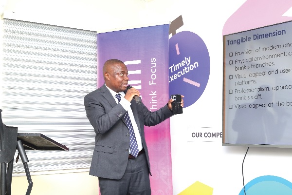 Musah Dankwah, Executive Director, Global Info analytics having a presentation of the research Zenith, CalBank tops customer satisfaction survey on banking