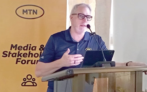 Stephen Blewett (inset), Chief Executive Officer of MTN Ghana, speaking at the event 