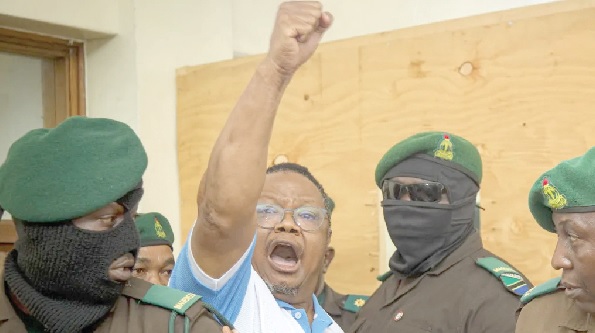 Tundu Lissu, Tanzanian opposition leader, shouting out a slogan to his supporters on his way to court Tundu Lissu, Tanzanian opposition leader, shouting out a slogan to his supporters on his way to court