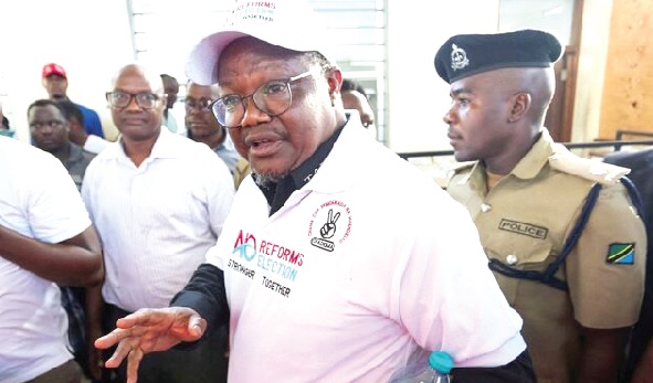 • Tundu Lissu, Tanzanian opposition leader, being escorted to court by police in the capital, Dar es Salam • Tundu Lissu, Tanzanian opposition leader, being escorted to court by police in the capital, Dar es Salam