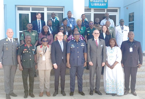 Air Commodore David Anetey Akrong (4th from right), acting Commandant of KAIPTC, and Jurgen Heissel (4th from left), Austrian Ambassador to Ghana, with participants in the programme