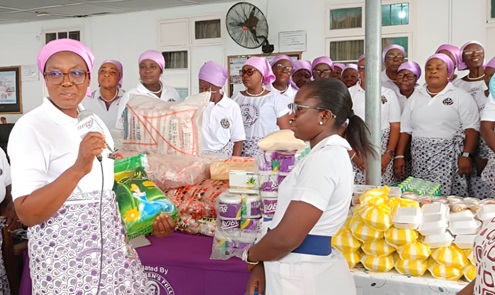 Caroline Kotei-Robertson (left), the Diocesan President, making the presentation to Dorcas Acheampong, Senior Nursing Officer in charge of Male Admission One Ward