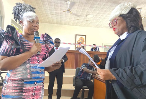Eunice Ohenewaa Ansu (left) being sworn in by Rosemary Afua-Asante, Juaben Circuit Court Judge