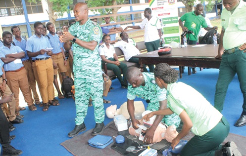 Sampson Donkor (left), Paramedic and Head of Emergency Medical Services, NAS, with his  EMS professionals demonstrating the cardiopulmonary resuscitation techniques to save a life during the 2025 World EMS Week celebration at Presbyterian Boys' Senior High School in Legon, Accra. Picture: ESTHER ADJORKOR ADJEI 
