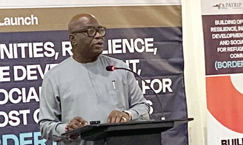 Ebenezer Oklertey Terlabi (inset), Deputy Minister for the Interior, addressing the invited guests at the launch Ebenezer Oklertey Terlabi (inset), Deputy Minister for the Interior, addressing the invited guests at the launch