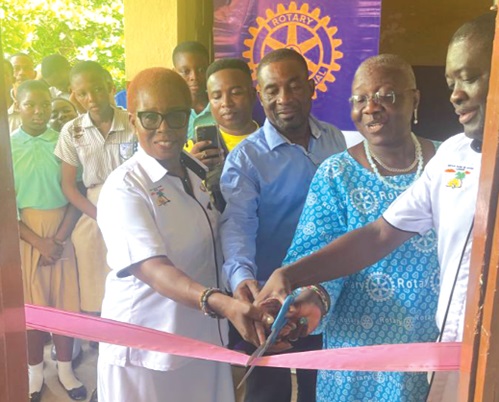 Frank Owusu Adjei (right), President of Rotary Club of Accra, Labone, and Raymond Konney (3rd from right), Headmaster of La Yahoshua Basic School, cutting the ribbon to signify the opening of the washrooms. With them are senior executives of the club. Frank Owusu Adjei (right), President of Rotary Club of Accra, Labone, and Raymond Konney (3rd from right), Headmaster of La Yahoshua Basic School, cutting the ribbon to signify the opening of the washrooms. With them are senior executives of the club.