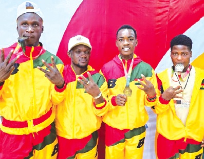 Member of the gold-winning Black Rockets team displaying their medals Member of the gold-winning Black Rockets team displaying their medals