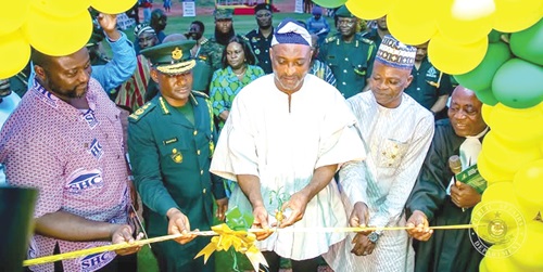 Mohammed-Mubarak Muntaka (middle), Interior Minister, being supported by Samuel Basintale Amadu (2nd from left), acting Comptroller-General of GIS; John Bawa (left), MD of State Housing Company, and Ali Adolf John (right), Northern Regional Minister, to inuagurate the facility. RIGHT: The accommodation facility