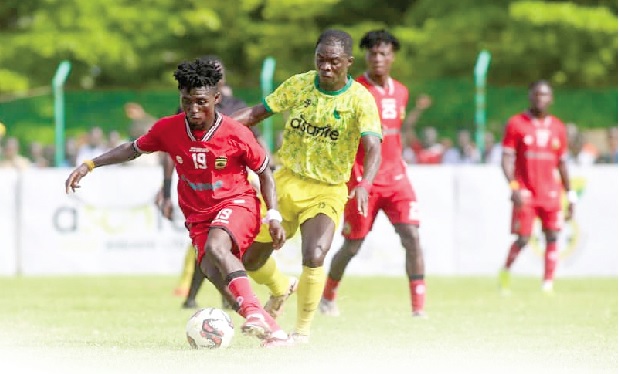 • Kotoko's Baba Yahaya controlling the ball away from his Samartex SC marker during the game yesterday • Kotoko's Baba Yahaya controlling the ball away from his Samartex SC marker during the game yesterday