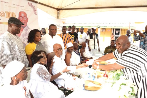 GCB Bank representatives presenting gifts to Eric Akoi Agyemfra, the centenarian GCB Bank representatives presenting gifts to Eric Akoi Agyemfra, the centenarian