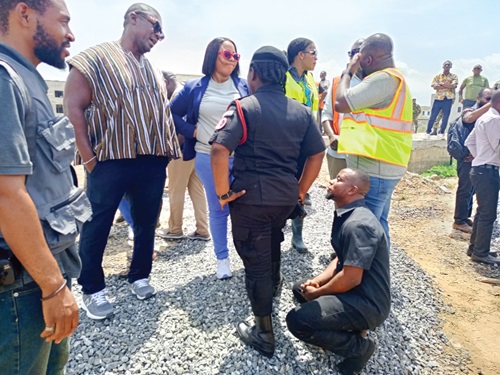  McDonald Owusu, a developer, kneeling to plead with the Greater Accra Regional Minister to spare his project from demolition