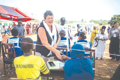 US Ambassador Virginia Palmer with election officials last year