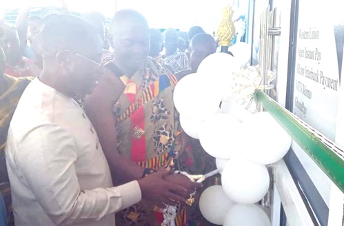 Dr Alex Adomako-Mensah (left), Board Chairman of the bank, together with Nana Dwamena Dankwa Dwebisaw, Chief of Drobonso, cutting the tape to inaugurate the new Drobonso branch building. INSET: The new Drobonso branch office building Dr Alex Adomako-Mensah (left), Board Chairman of the bank, together with Nana Dwamena Dankwa Dwebisaw, Chief of Drobonso, cutting the tape to inaugurate the new Drobonso branch building. INSET: The new Drobonso branch office building