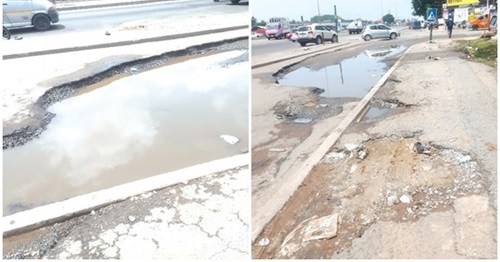 Potholes filled with water at Dansoman Junction in Accra Potholes filled with water at Dansoman Junction in Accra