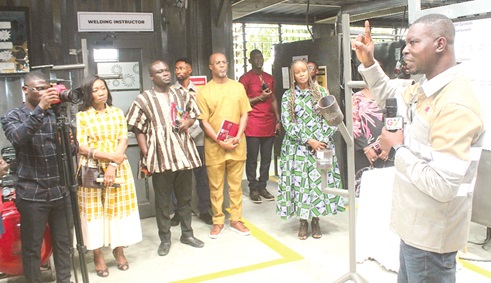 Isaac Tetteh (right), Head of Welding, Design and Technical Institute, conducting Constance Swaniker (2nd from right), founder, Design and Technical Institute, and other dignitaries round the newly commissioned centre