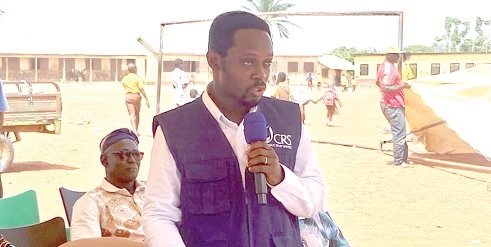 Festus Fofie (left), WASH Programme Director at CRS, speaking at the event