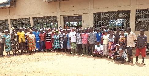 Members of the delegation on the field trip with some of the beneficiary farmers after the engagement