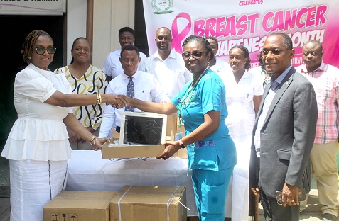 Yasmin Mensah (left), Managing Director of Edward Mensah, Wood, and Associates Ltd, presenting oxygen concentrators to Dr Maame Yaa Nyarko (2nd from right), Medical Superintendent of the Princess Marie Louise Hospital in Accra. With them are Rev. Daniel Annan (right), Financial Director of EMWA, and other EMWA representatives and hospital staff. Picture: ESTHER ADJORKOR ADJEI.