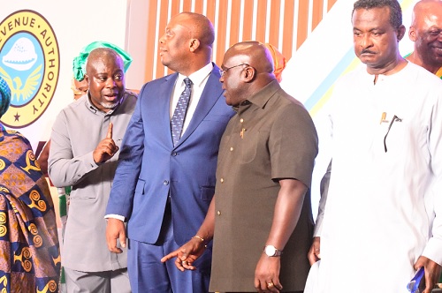 Julius Debrah (2nd from right), Chief of Staff, Office of the President, interacting with Anthony K. Sarpong (extreme left), acting Commissioner-General, GRA, after the launch of the Sustainable National Tax in Accra. Those with them are George Kweku Ricketts-Hagan (right), Board Chairman, GRA, and Thomas Nyarko Ampem (2nd from left), Deputy Minister of Finance. Picture: SAMUEL TEI ADANO
