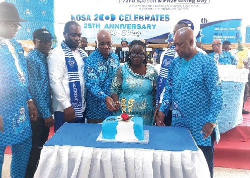 Justice Jones Dotse (middle), retired Justice of the Supreme Court, being assisted by Rose Nyawuto (3rd from right), Headmistress of Mawuko SHS, and Charles Apreku (right), Headmaster, Kpando Senior High School, to cut the anniversary cake