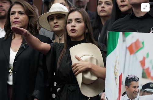 Grecia Quiroz is sworn in as mayor of Uruapan, Mexico's avocado capital, after the state congress unanimously approved her appointment to replace her husband, Carlos Manzo