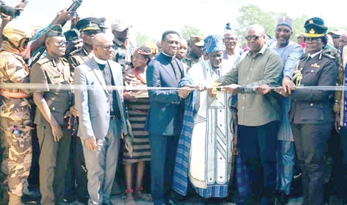 An Administrative Block of the Prison Camp in Damongo. INSET: President John Mahama (3rd from right) being suported by Patience Baffoe-Bonnie (right),  Director-General, Ghana Prison Service; Apostle Dr Eric Kwabena Nyemekye (5th from right), Chairman, Church of Pentecost, and other dignitaries and traditional rulers to inaugurate the camp
