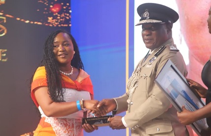 IGP Christian Tetteh Yohuno (right) presenting the Best Female Journalist (2024) Award to Doreen Ampofo of the Ghana Broadcasting Corporation