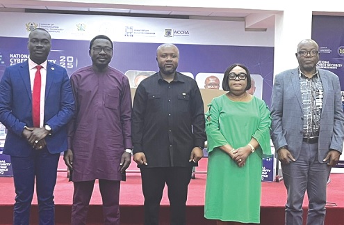 Professor Diyawu Mumin (2nd from left), Executive Director, Centre for National Distance Learning and Open Schooling, Devine Selassie Agbeti (middle), acting Director-General, Cyber Security Authority, and others after the event