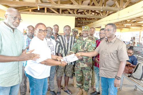 Captain Clifford Agyarko-Osei  (right) presenting the Inland Waterways Casualty Investigation Report to Madam Jemilat Jawula Mahama, Board Chairperson of the GMA. On the left is Dr Kamal-Deen Ali, Director-General of the GMA