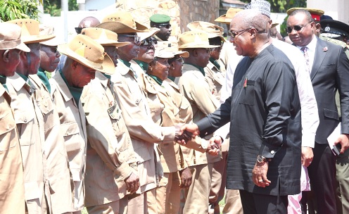 President John Dramani Mahama exchanging pleasantries with some of the veterans at the Remembrance Day celebration in Accra. INSET: President Mahama laying a wreath. Picture: SAMUEL TEI ADANO