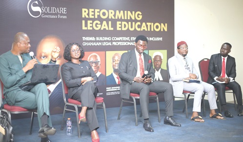 Prof. Raymond Atuguba (left), acting Director, Legal Education and Director, Ghana School of Law, answering questions during the panel discussion. With him are Dr Francisca Kusi Appiah (2nd from left), Vice Dean, UPSA Law School; Prof. Peter Atudiwe (2nd from right), Dean, UG School of Law, and Benjamin Alpha Aidoo (right) Picture: BENEDICT OBUOBI