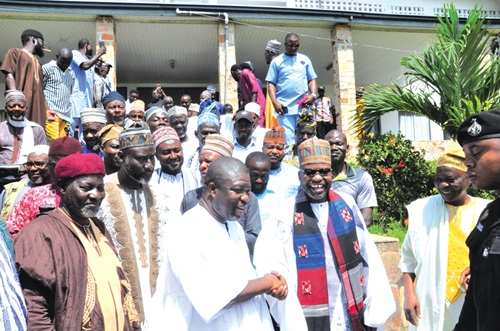 James Gunu (2nd from left), Volta Regional Minister, and Alhaji Muniru Ali Mohamed, the Regional Chief Imam, in a hearty handshake, while other members of the visiting delegation look on