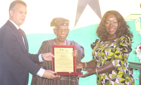 Mourad Louhaidia (left), Algerian Ambassador to Ghana, and Elizabeth Ofosu Adjare (right), the Minister of Trade, Agribusiness and Industry, presenting a citation to Sena Ocloo (2nd from right) for his longstanding friendship with Algeria. Picture: ESTHER ADJORKOR ADJEI 