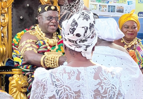 Otoobuor Djan Kwasi II (left) exchanging pleasantaries with some of the dignitaries at the festival.