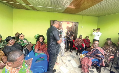 Ernest Brogya Genfi, Deputy Minister of Defence, speaking to the family of the late Priscilla Efua Larbi at Enyan-Maim in the Ajumako Enyan Essiam District in the Central Region