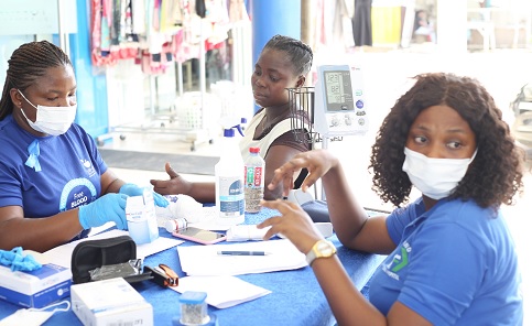 Nurses (in face masks) taking samples from a beneficiary of the free screening. Picture: BENEDICT OBUOBI