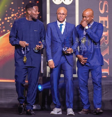 • Former Black Stars captains, Asamoah Gyan (left) and Andre Ayew (middle) are joined by football administrator, Samuel Anim Addo to recieve the SWAG Lifetime Achievement Awards