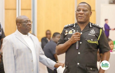 Christian Tetteh Yohuno, Inspector-General of Police, addressing the gathering. With him is Edward Ato Sarpong, MD, ADB