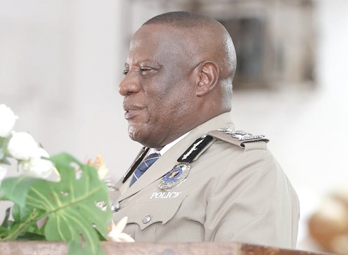 Christian Tetteh Yohuno  (inset), Inspector General of  Police, addressing the gathering