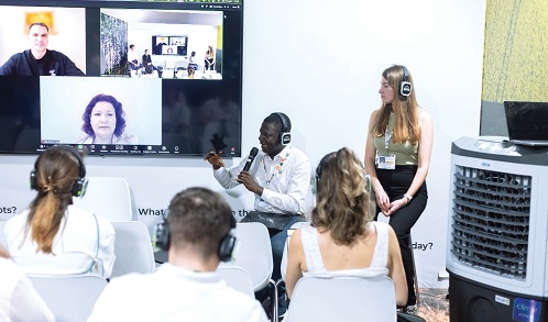 Dr Glenn Kwabena Gyimah, General Manager  of the Green Transition Office at JGC, explaining a point during a panel discussion at COP30 