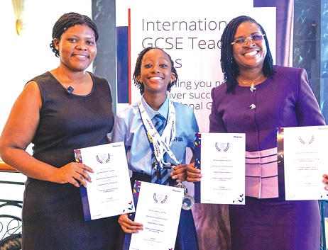 Dr Akorfa Afi Adorble (left), the Head of Academics of Daffodil International  School-Tema; Benita Lesikwor Sackey (middle), the awardee, and Adwoa Nhyira Apeaning (right), the Head of Daffodil International School-Tema, displaying the awards
