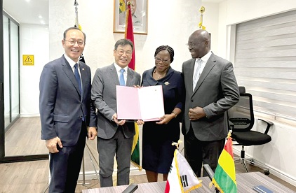 Dr Cassiel Ato Forson (right),  Minister of Finance; Dr Audrey Smock Amoah (2nd from right), acting Director-General, National Development Planning Commission; Donghyun Lee (2nd from left), Country Director, KOICA Ghana, and Park Kyonsig, the Korean Ambassador, displaying the signed document.