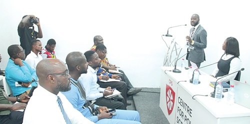 Dr Adu Owusu Sarkodie (standing), Executive Director, Centre for Policy Scrutiny, making a presentation.  Picture: ERNEST KODZI