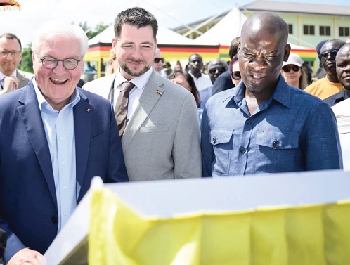 Frank-Walter Steinmeier (left), German President, with Joern Halsinger (middle), CEO of Code Raccoon Ltd, and Haruna Iddrisu (right), Minister of Education, inspecting a project at the Kumasi Technical Institute