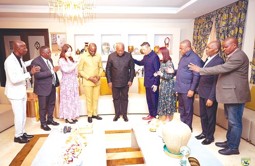 Rev. Dominic Yeo (5th from right) and his delegation praying for President John Dramani Mahama