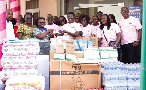 Patricia Isabella Essel (5th from right),  Founder of Patbella Hope Foundation, presenting the items to Naomi Oyoe Ohene Oti (3rd from left), Head of Nursing, National Radiotherapy and Nuclear Medicine Centre, Korle Bu.  Picture: EDNA SALVO KOTEY