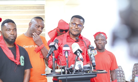 Gabriel Madobi, convenor, former workers, Bogoso-Prestea Mines, addressing the press conference held in Accra. Behind him are some former workers of the company. Picture: BENEDICT OBUOBI